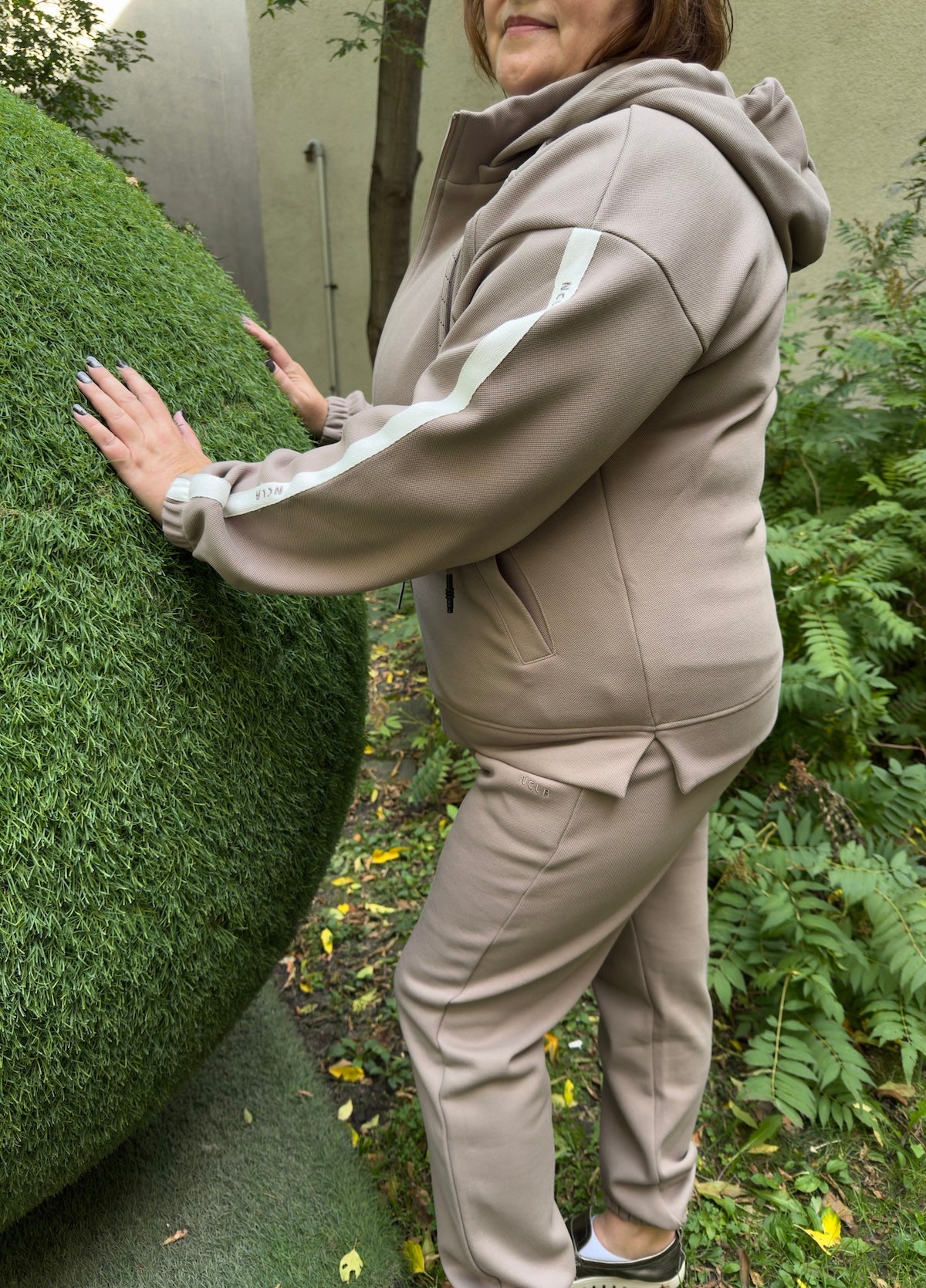 Side view of plus size tracksuit with stripe detail – By Zola