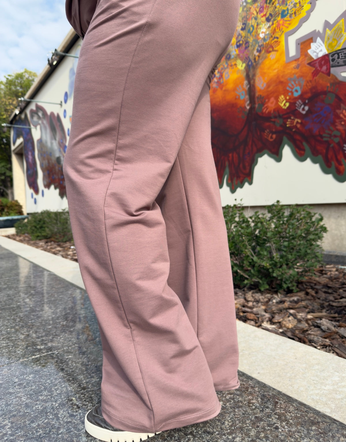Side view of tall plus size woman in taupe knit tracksuit – By Zola Canada