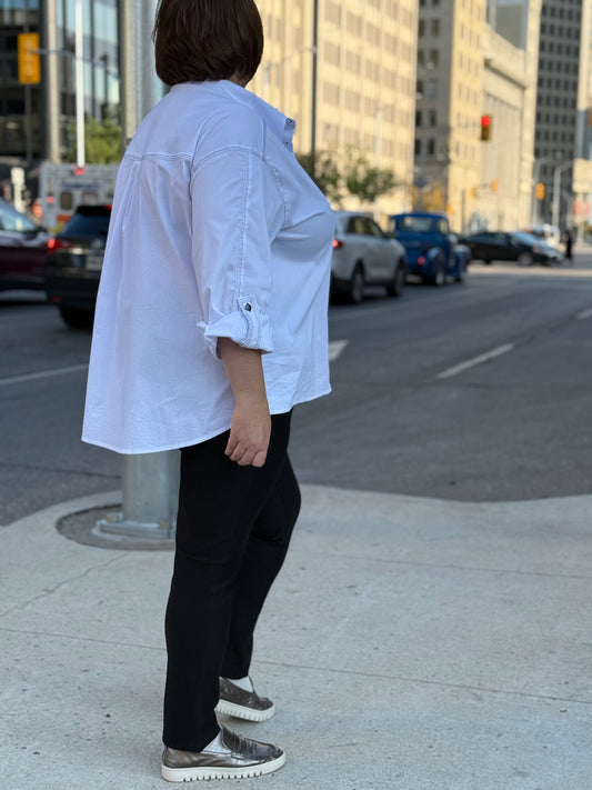 Plus-size model wearing white cotton shirt with contrast stitching – By Zola