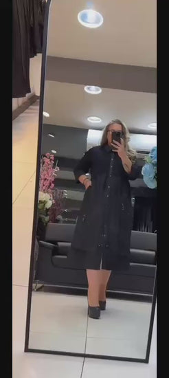 Plus-size model wearing black satin-collar dress – By Zola City Chic Collection