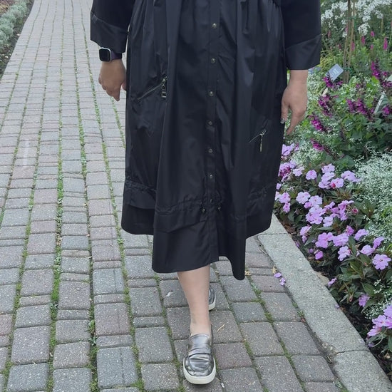 Elegant plus-size black dress styled with heels or sneakers – By Zola Winnipeg